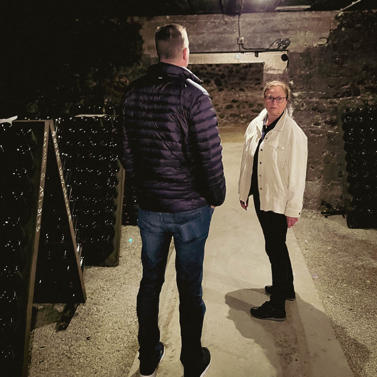 Jason Berry of Amitié Wines with Sandrine Lejeune in the Pascal Lejeune cellar — Moussy, Champagne