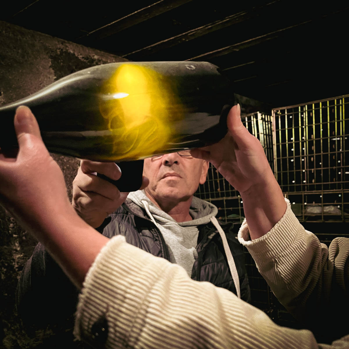 Pascal Lejeune checking lees in the cellar — Champagne Pascal Lejeune, Moussy, Coteaux Sud d'Épernay