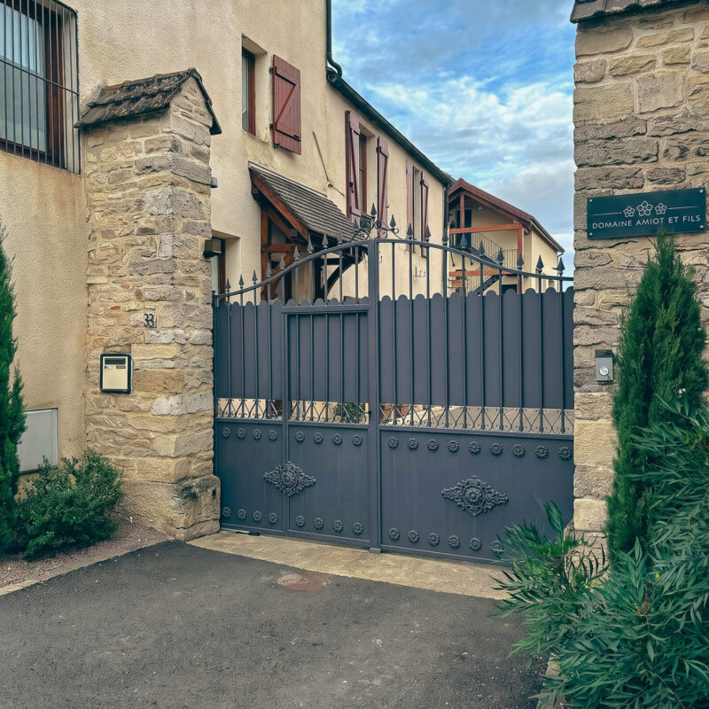 Domaine Amiot et Fils — entrance gate with the three roses insignia, Morey-Saint-Denis, Burgundy