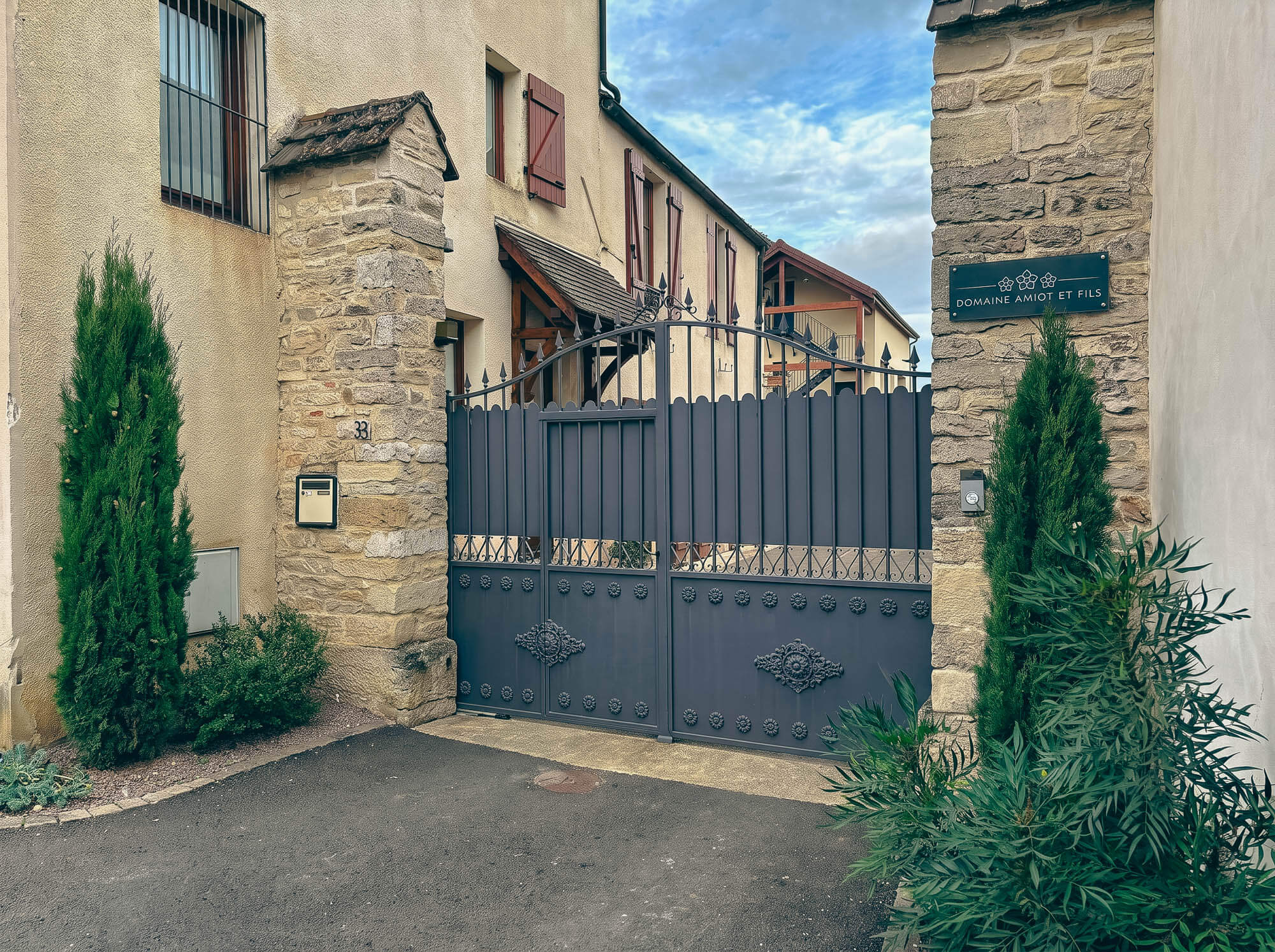 Domaine Amiot et Fils — entrance gate with the three roses insignia, Morey-Saint-Denis, Burgundy